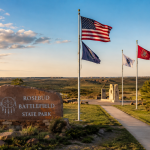 Visitors exploring the prairie landscape near Little Bighorn Battlefield during commemorative events in Montana